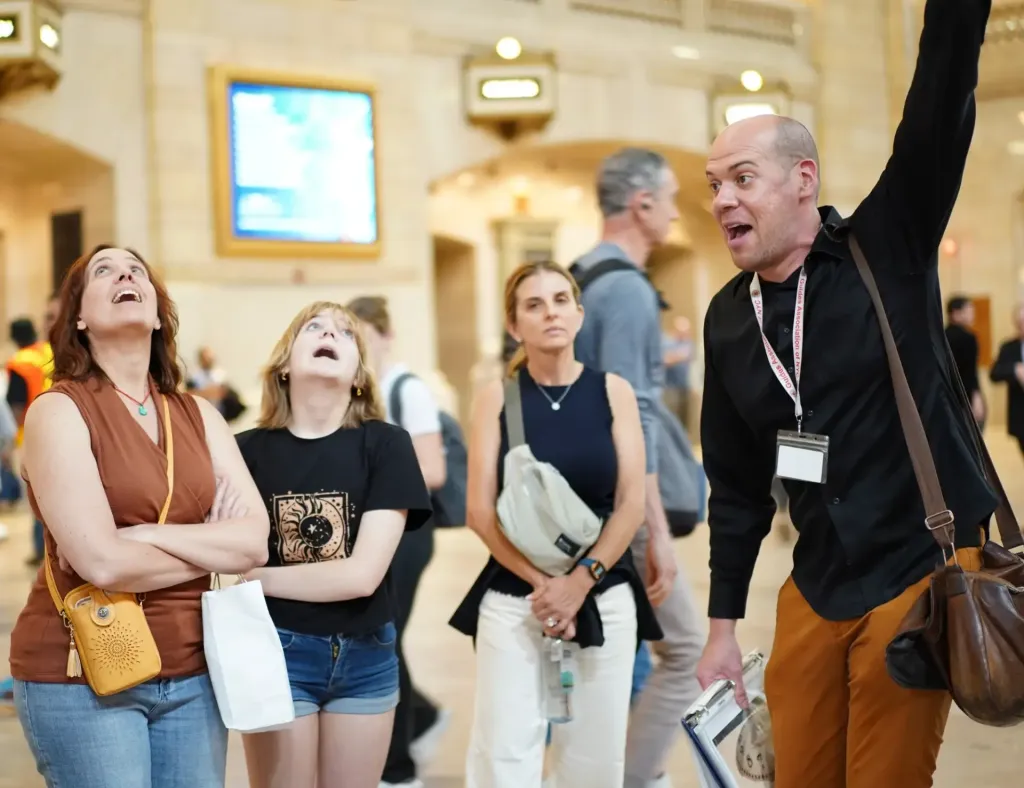guests on a walking tour looking at the ceiling