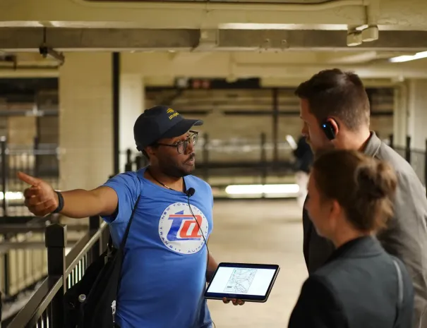 guide pointing and talking to guests