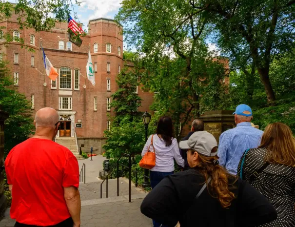 A tour group outside the Central Park Arsenal