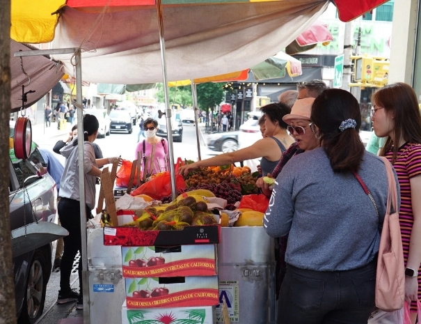 People shopping at a food stand