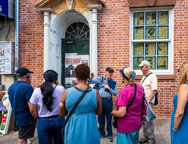 Tour guests in front of a building in Chinatown