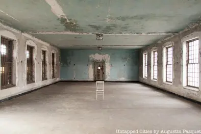 abandoned room with chair in the middle