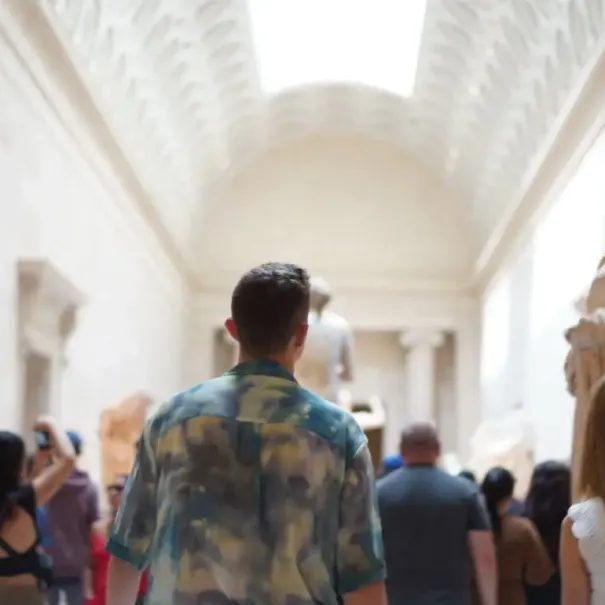 Visitors walk through a sculpture gallery at the Metropolitan Museum of Art