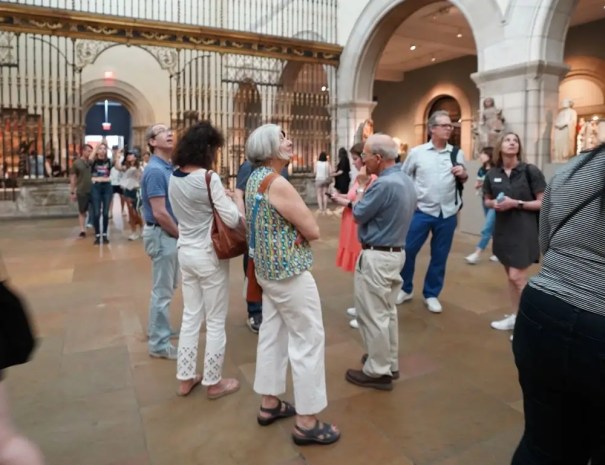Visitors gaze up at the ceiling of the Metropolitan Museum of Art