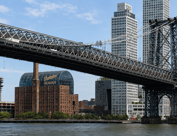 The Williamsburg Bridge framing the Domino Sugar refinery on the East River