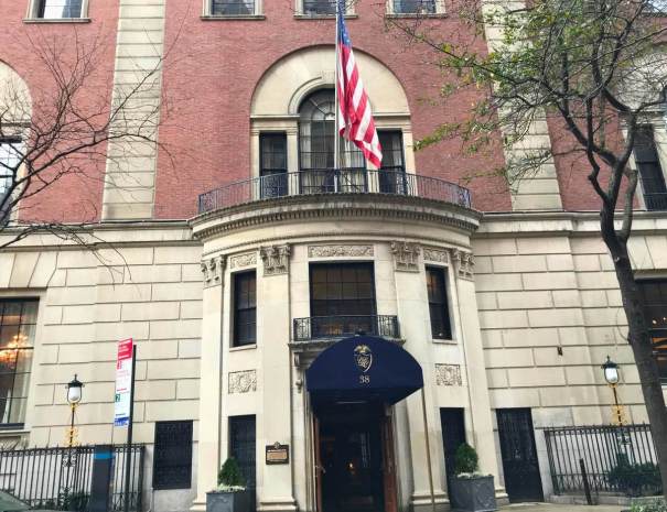 The Union League Club at 38 East 37th Street, a red-brick and limestone clubhouse with an American flag above its navy entrance awning.